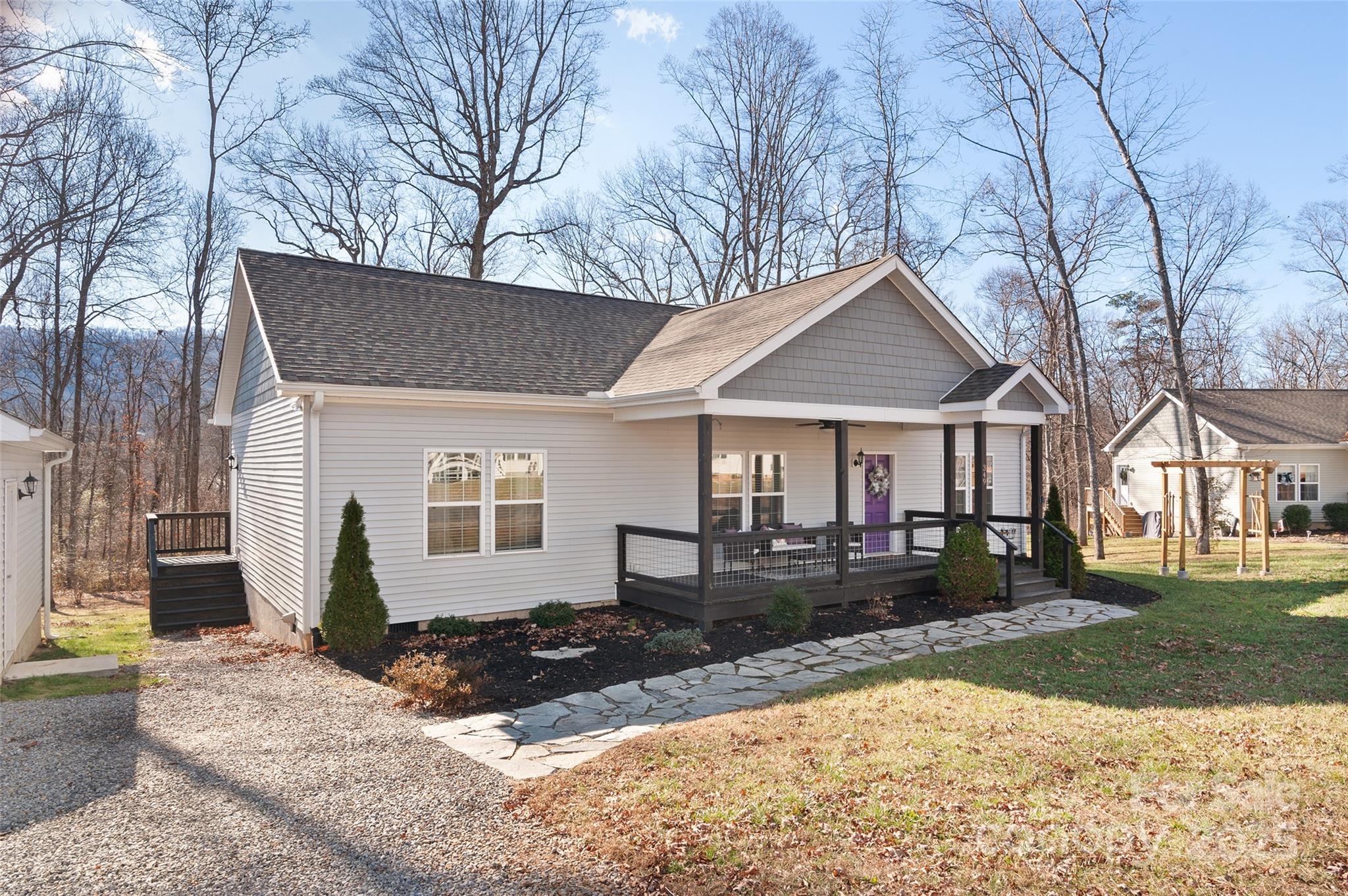 349 Ridge View Drive Clyde, NC 28721 - Photo 1 of 27 a front view of a house with garden