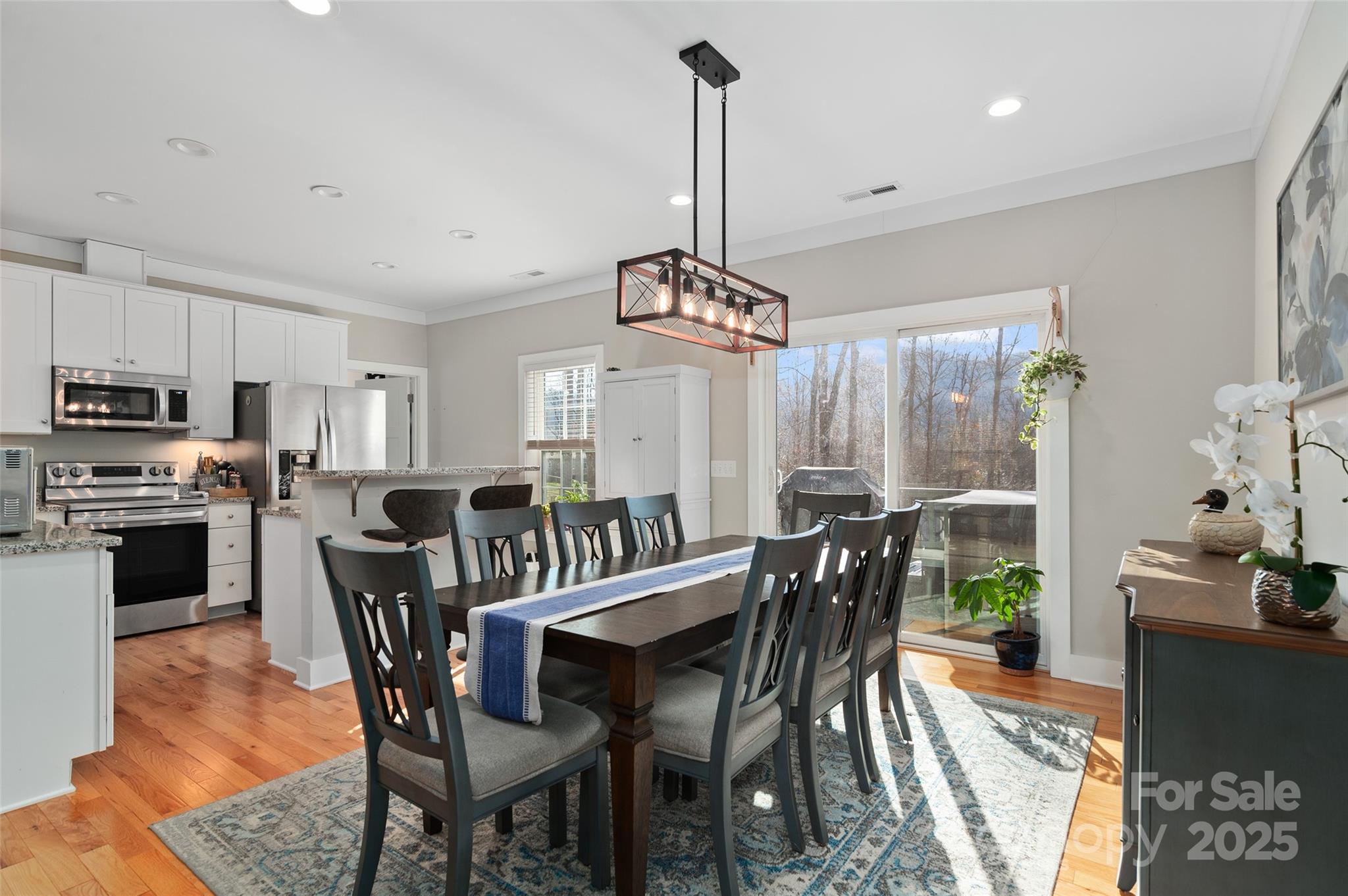 349 Ridge View Drive Clyde, NC 28721 - Photo 11 of 27 a view of a dining room with furniture window and wooden floor