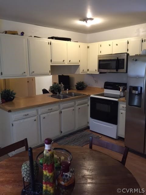 5418 South Jessup Road Chesterfield, VA 23832 - Photo 2 of 14 a kitchen with stainless steel appliances granite countertop a sink and cabinets
