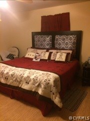 5418 South Jessup Road Chesterfield, VA 23832 - Photo 6 of 14 a bed sitting in a bedroom next to a lamp