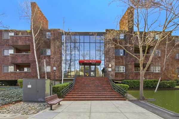 a front view of a building with garden