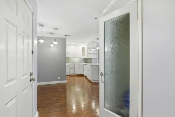 a bathroom with a shower and a glass door