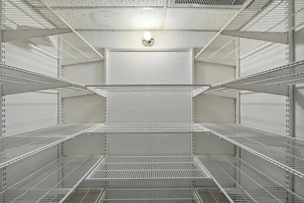 a view of a room with racks on the wall