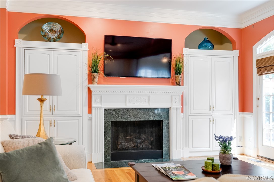 11907 Reeds Bluff Lane Midlothian, VA 23113 - Photo 13 of 50 Gas fireplace flanked by a pair of built-in cabine