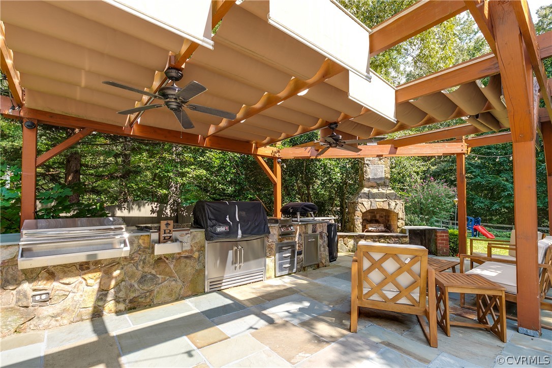 11907 Reeds Bluff Lane Midlothian, VA 23113 - Photo 45 of 50 Deluxe outdoor kitchen with retractable awning