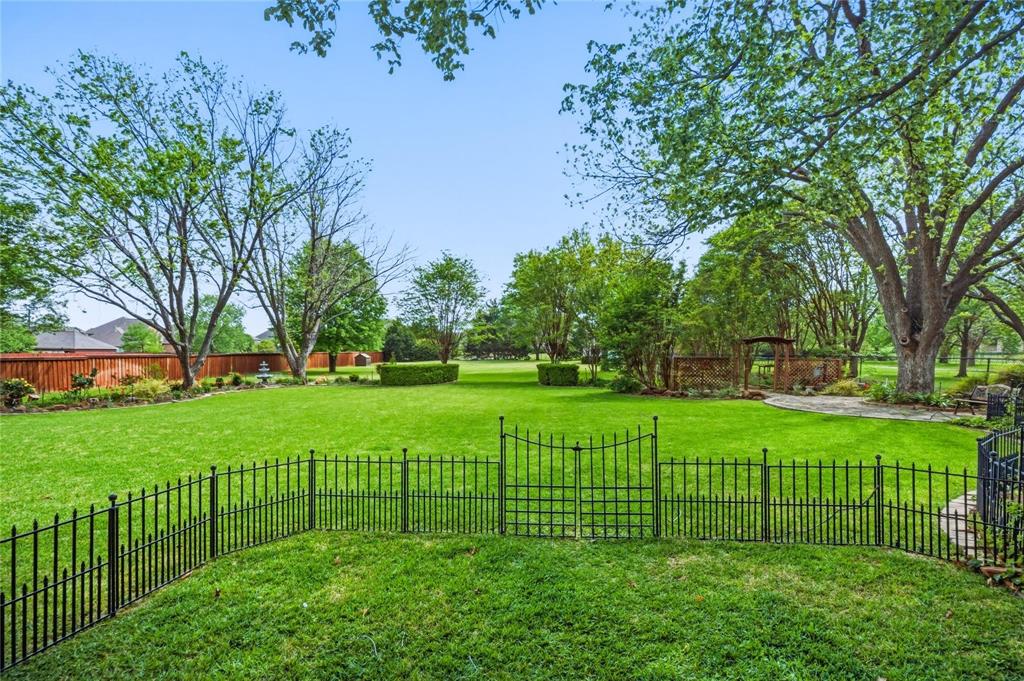 265 East Dove Road Southlake, TX 76092 - Photo 34 of 39 a view of a park with a large trees with wooden fence