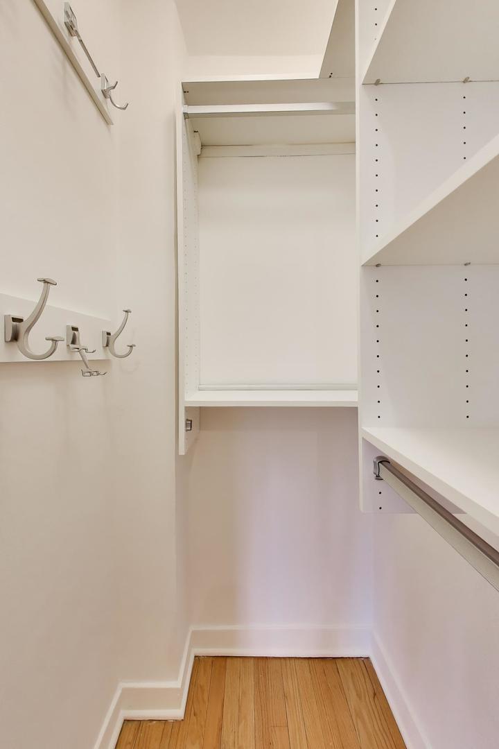 1929 Sherman Avenue, Unit 2W Evanston, IL 60201 - Photo 19 of 26 a view of a room with rack on the wall