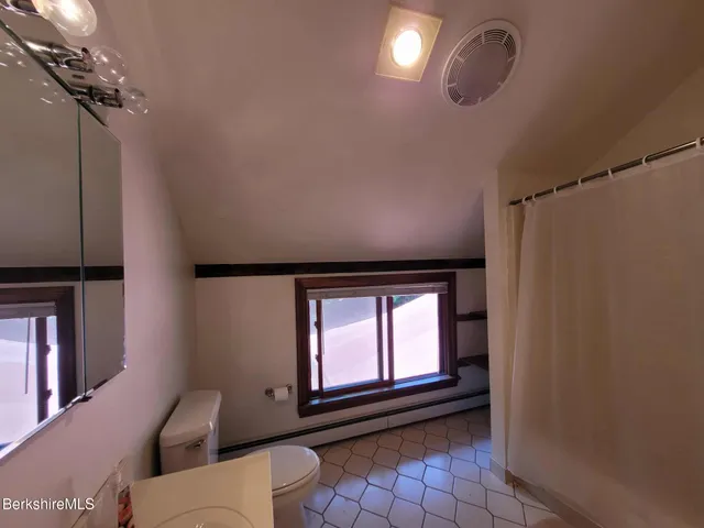 a view of empty room with windows