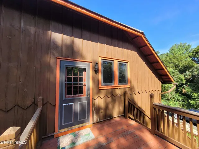 a view of deck with wooden floor and fence