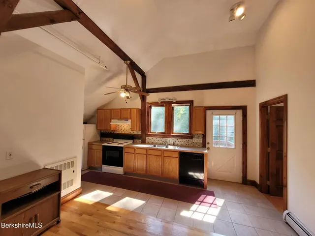 a kitchen with stainless steel appliances granite countertop a stove and a sink