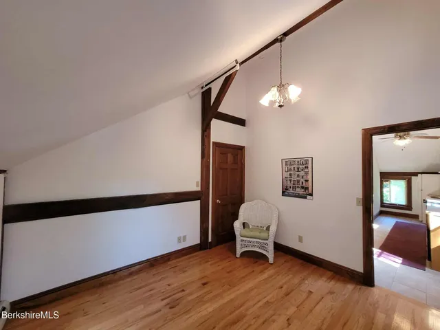 a view of a livingroom with furniture and staircase