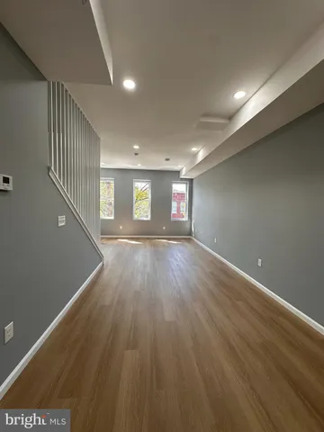a view of room window and wooden floor