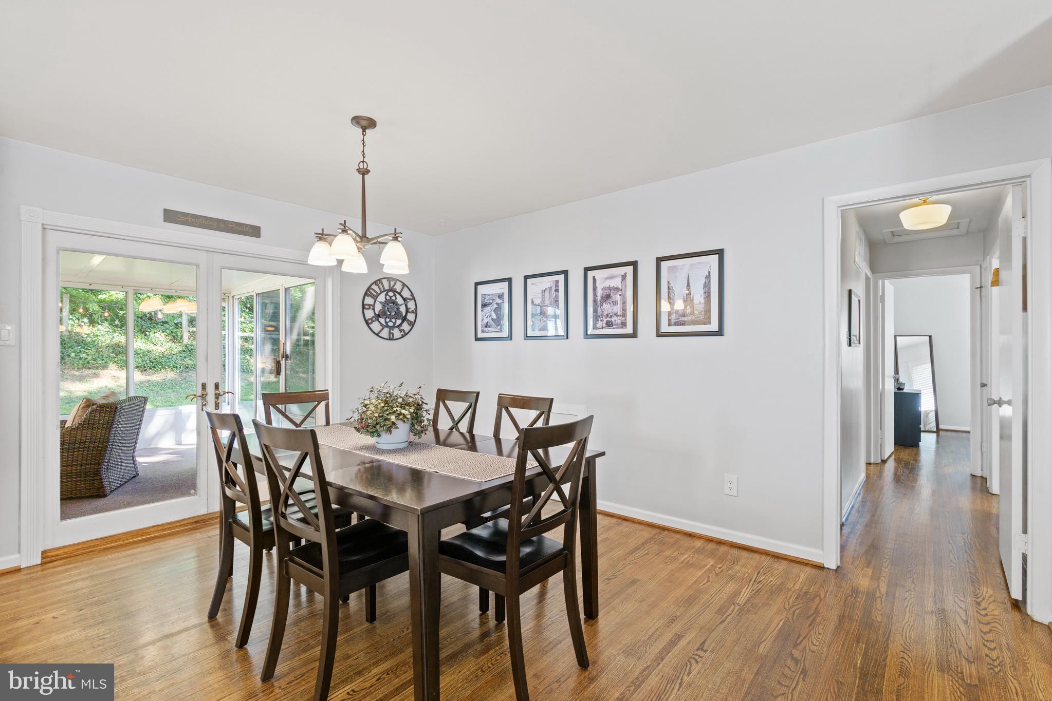 8608 Langport Drive Springfield, VA 22152 - Photo 11 of 43 a view of a dining room with furniture window and wooden floor