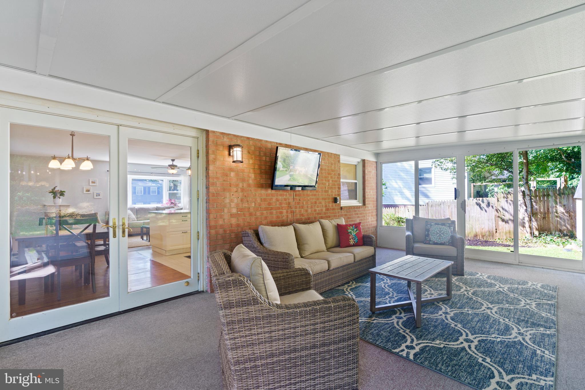 8608 Langport Drive Springfield, VA 22152 - Photo 12 of 43 a living room with furniture and a floor to ceiling window