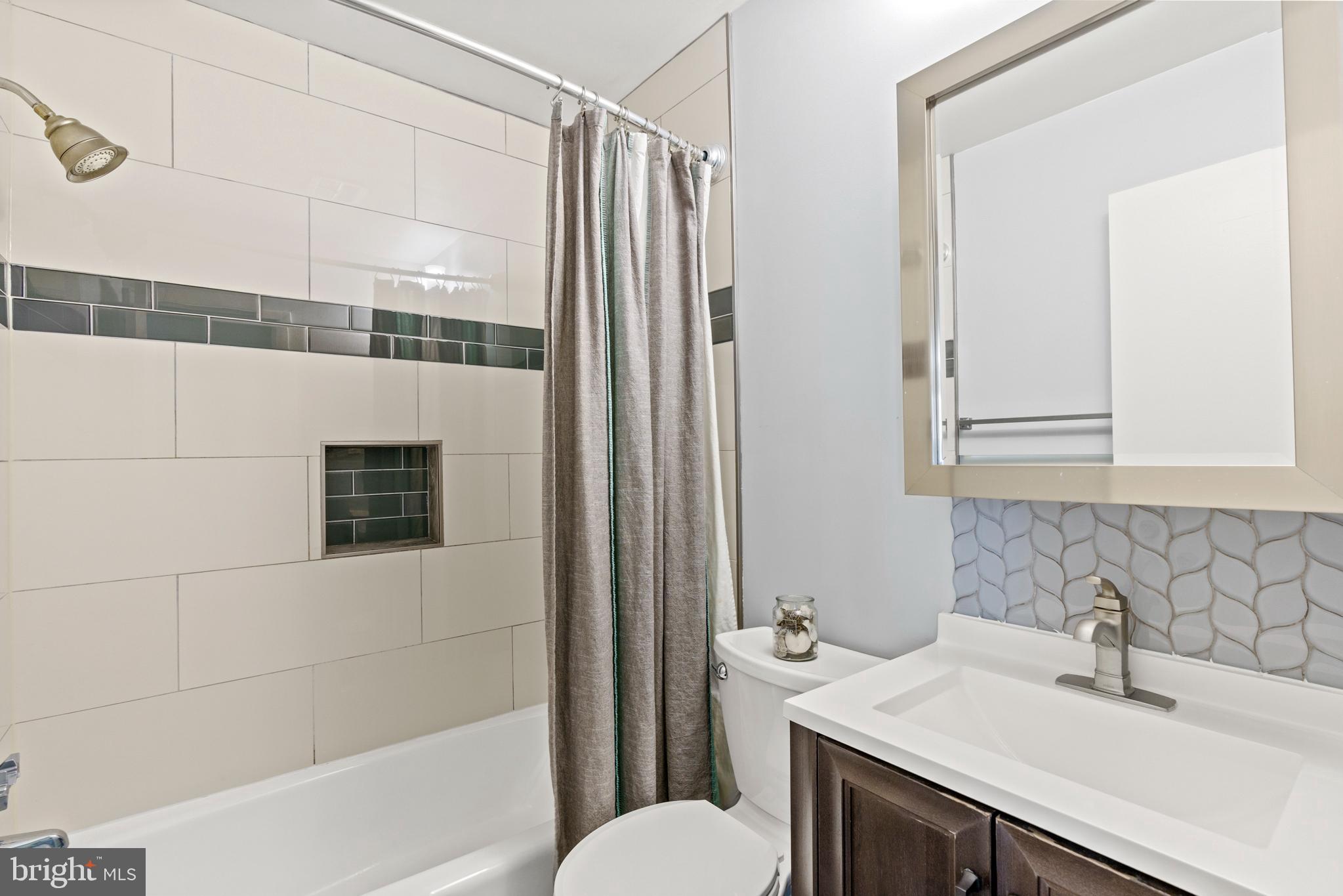 8608 Langport Drive Springfield, VA 22152 - Photo 15 of 43 a bathroom with a sink and a mirror