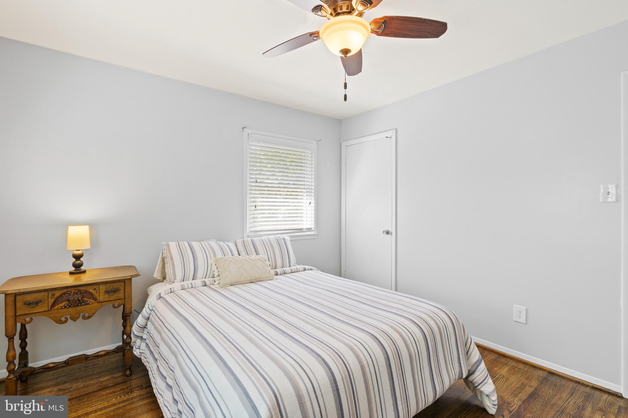 8608 Langport Drive Springfield, VA 22152 - Photo 19 of 43 a bedroom with a bed and a chandelier
