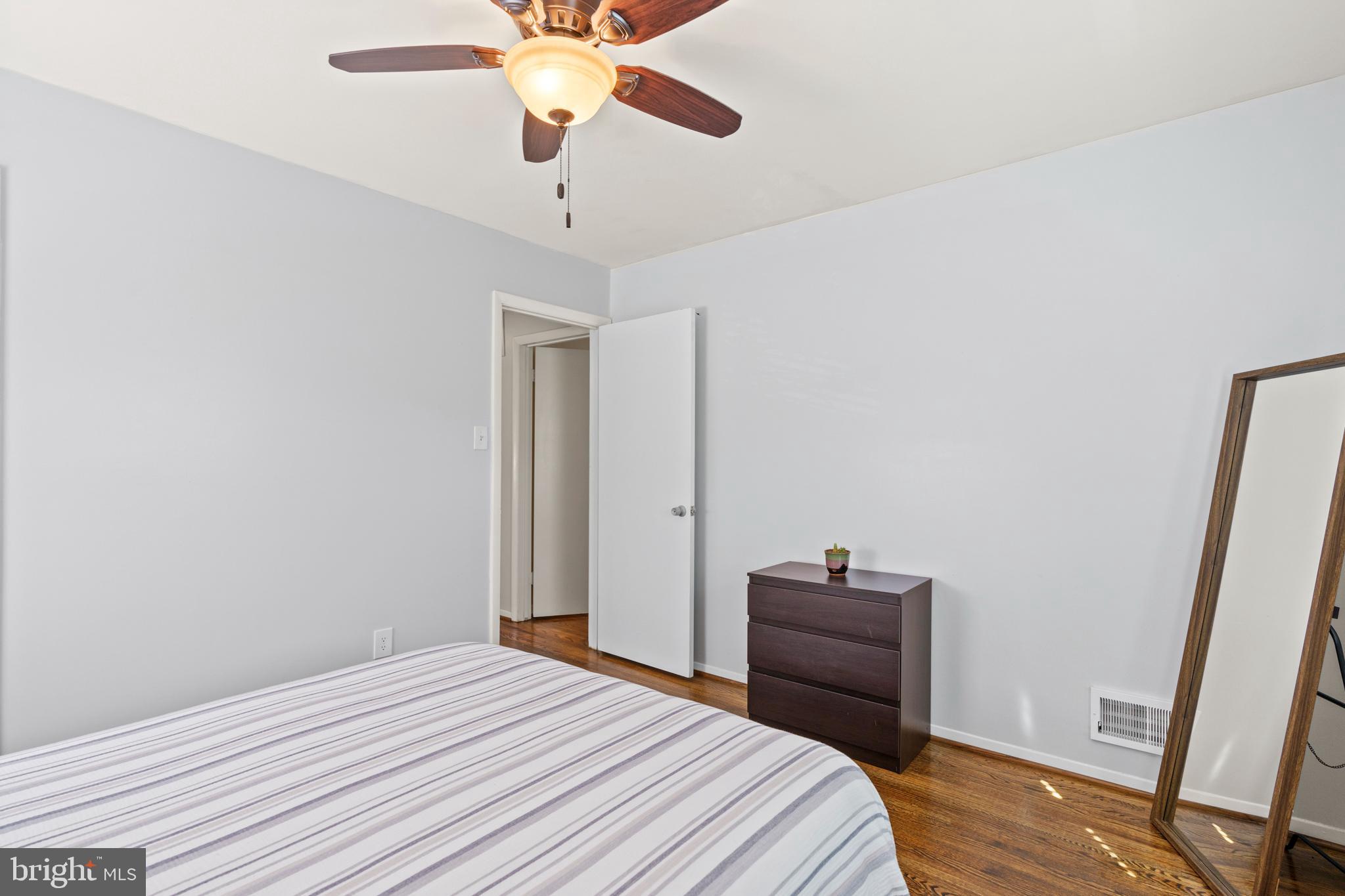 8608 Langport Drive Springfield, VA 22152 - Photo 20 of 43 a bedroom with a bed and a mirror