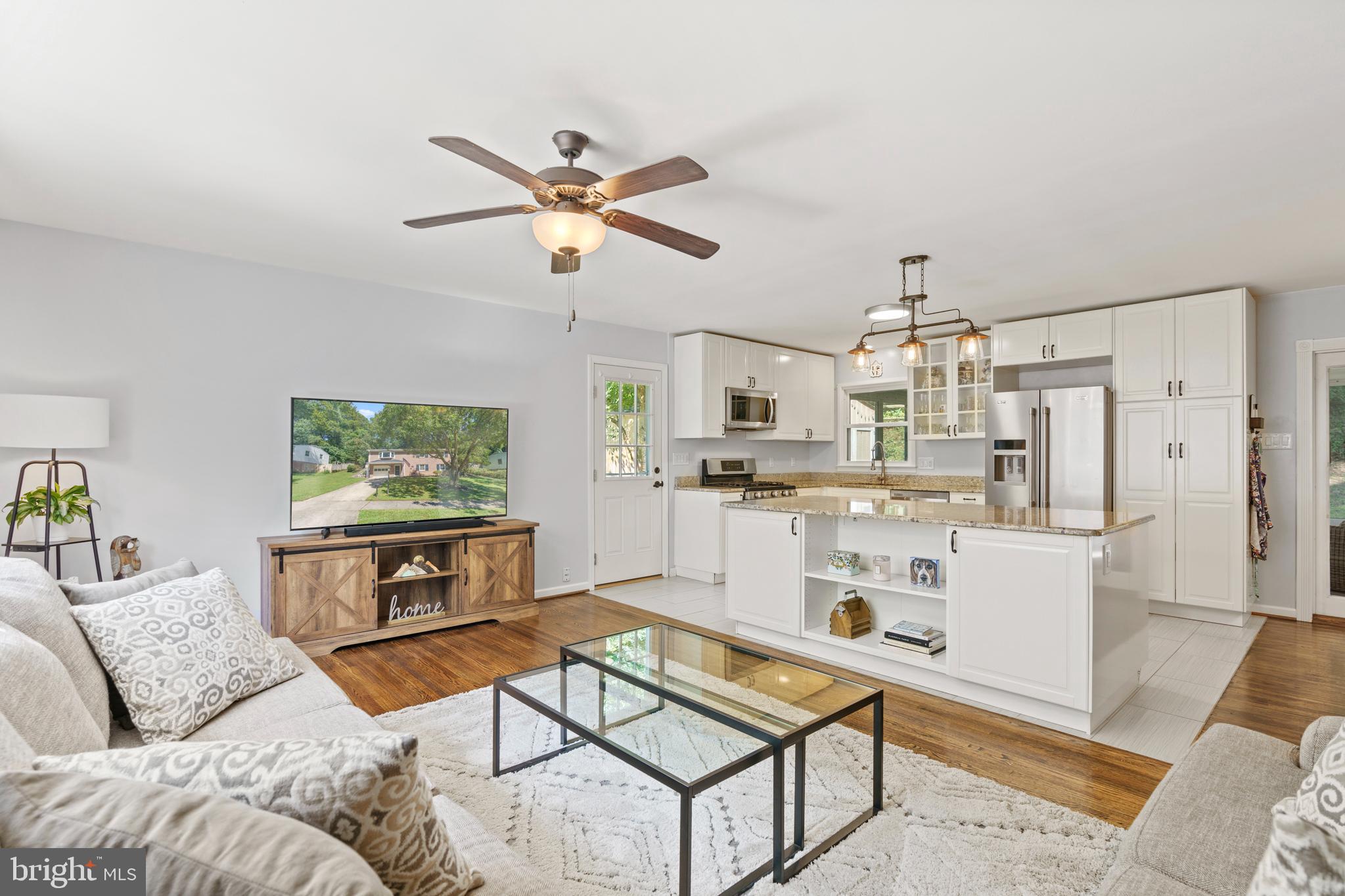 8608 Langport Drive Springfield, VA 22152 - Photo 2 of 43 a living room with furniture and kitchen view