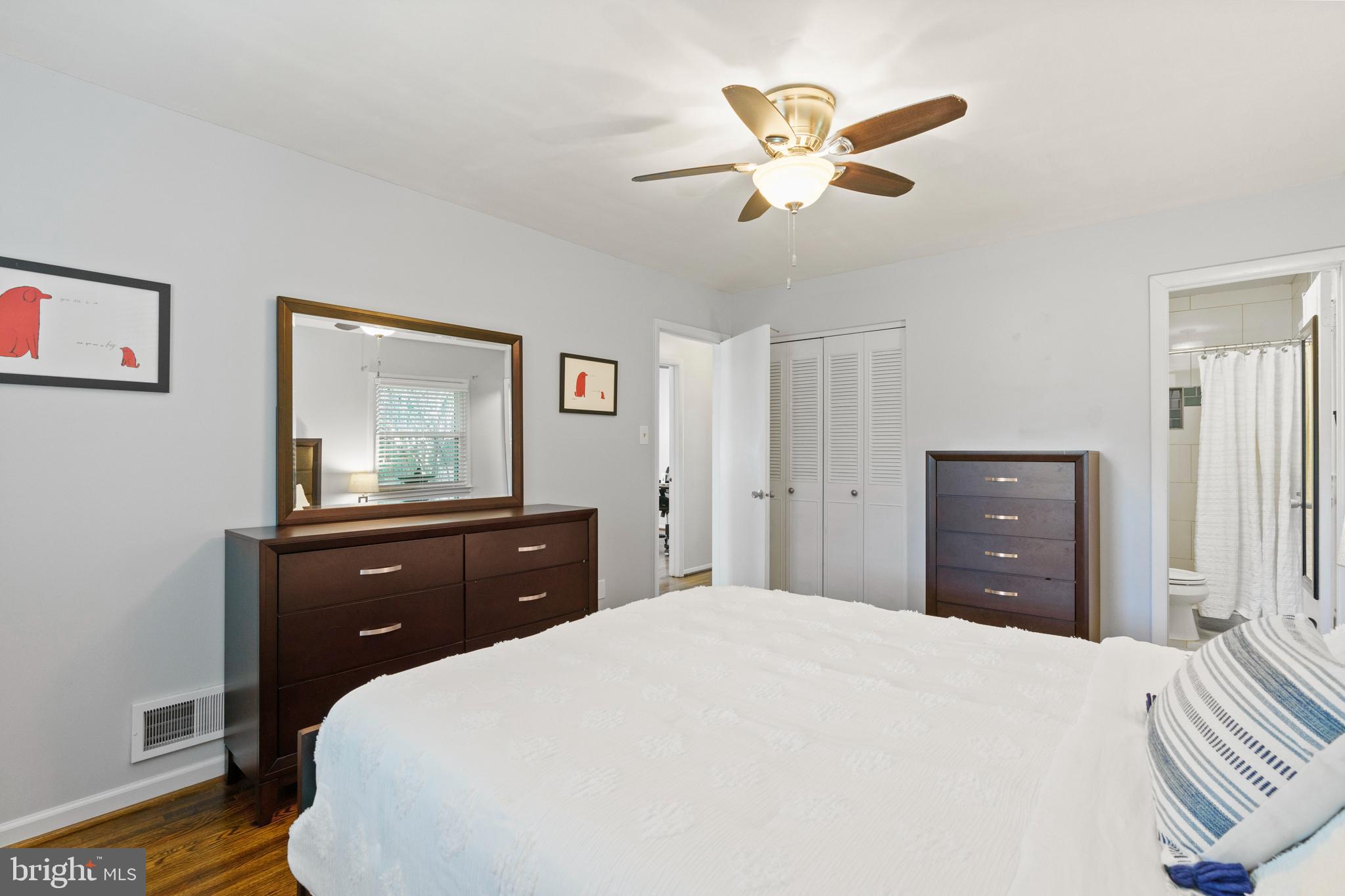 8608 Langport Drive Springfield, VA 22152 - Photo 22 of 43 a bedroom with a bed and a chandelier