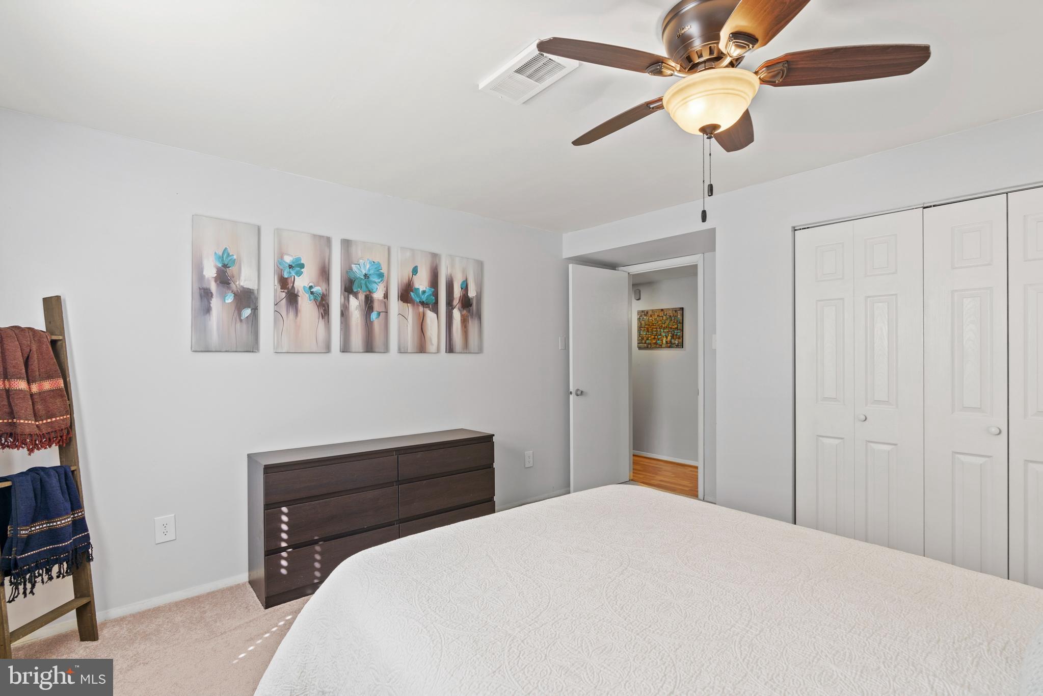 8608 Langport Drive Springfield, VA 22152 - Photo 33 of 43 a bedroom with a bed and a chandelier