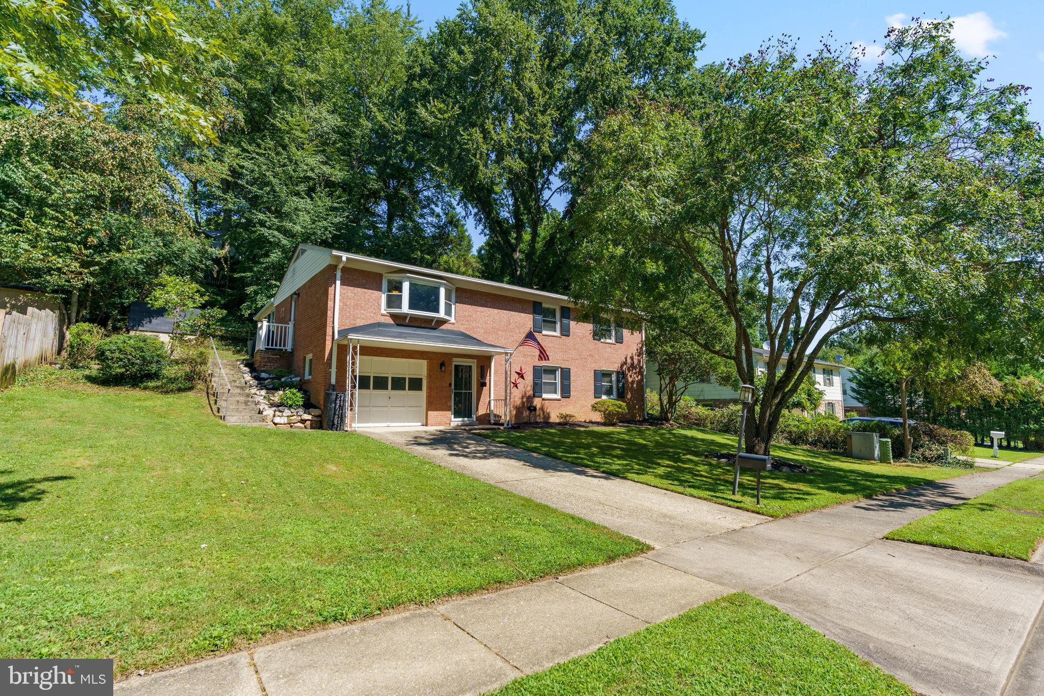8608 Langport Drive Springfield, VA 22152 - Photo 43 of 43 a front view of a house with a yard