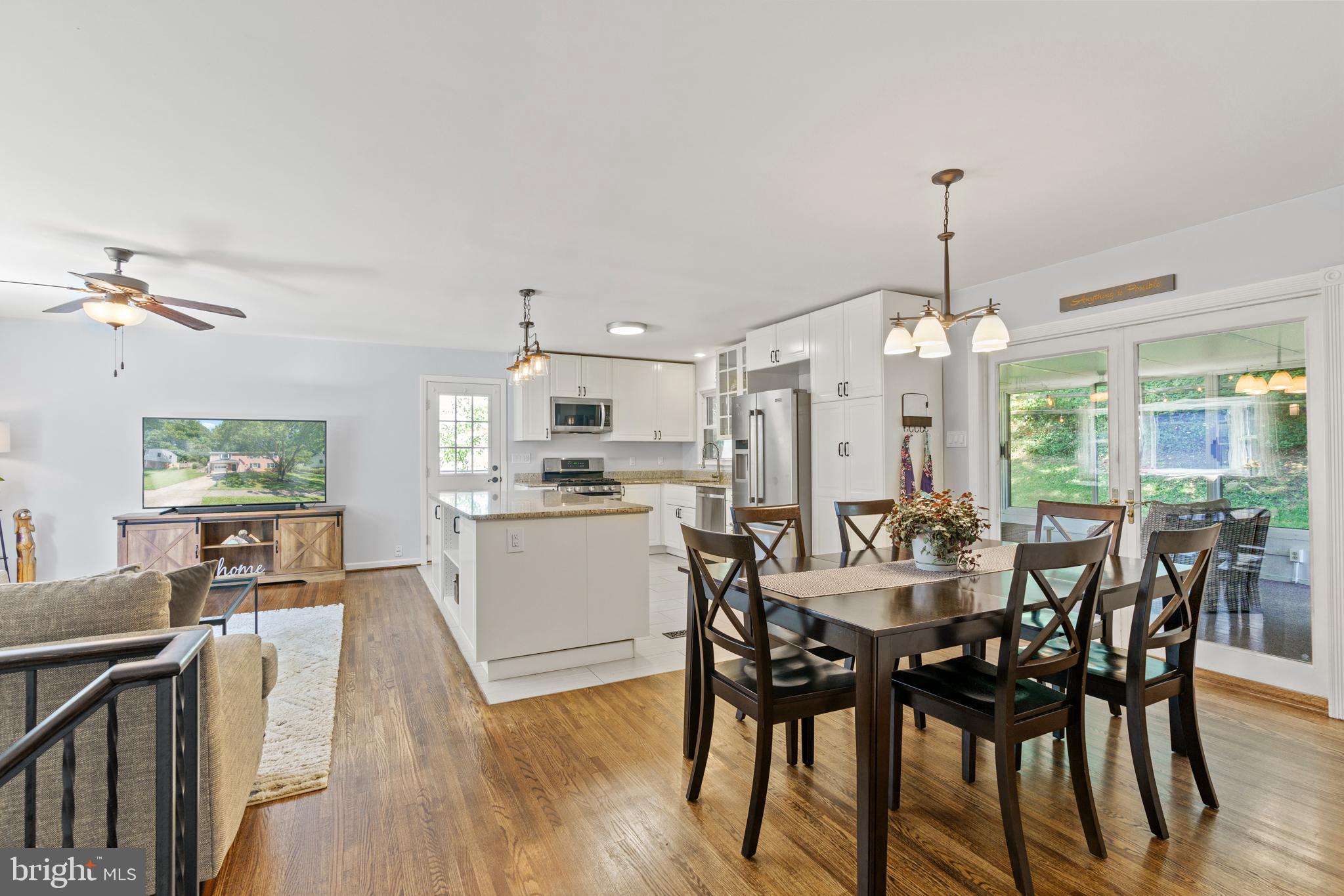 8608 Langport Drive Springfield, VA 22152 - Photo 10 of 43 a view of a dining room with furniture window and wooden floor