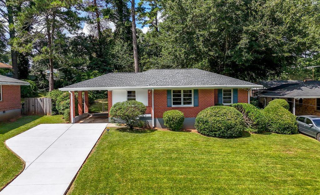 2134 Trailwood Road Decatur, GA 30032 - Photo 1 of 1 a front view of a house with a yard