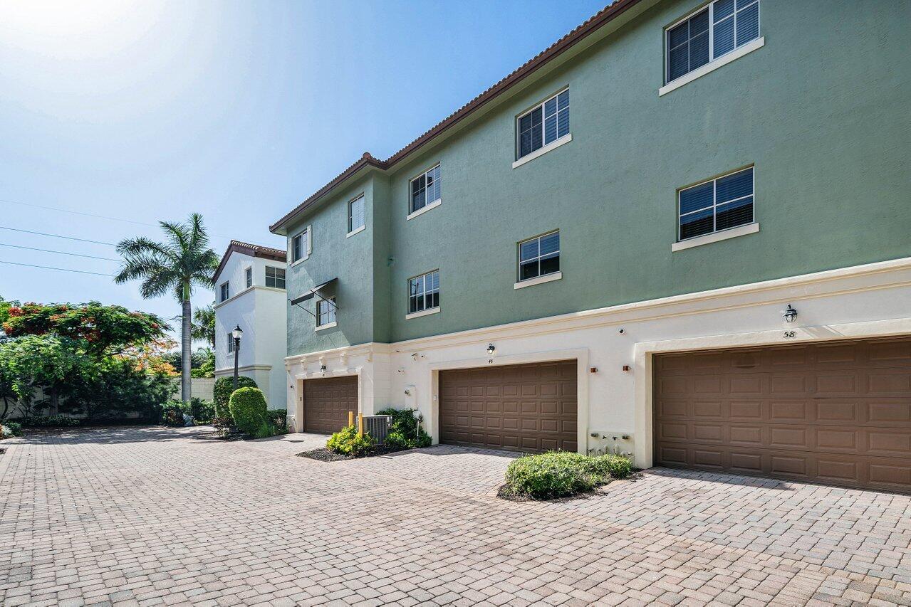 48 Northwest Hawthorne Place Boca Raton, FL 33432 - Photo 32 of 35 Rear Exterior / Garage Entrance