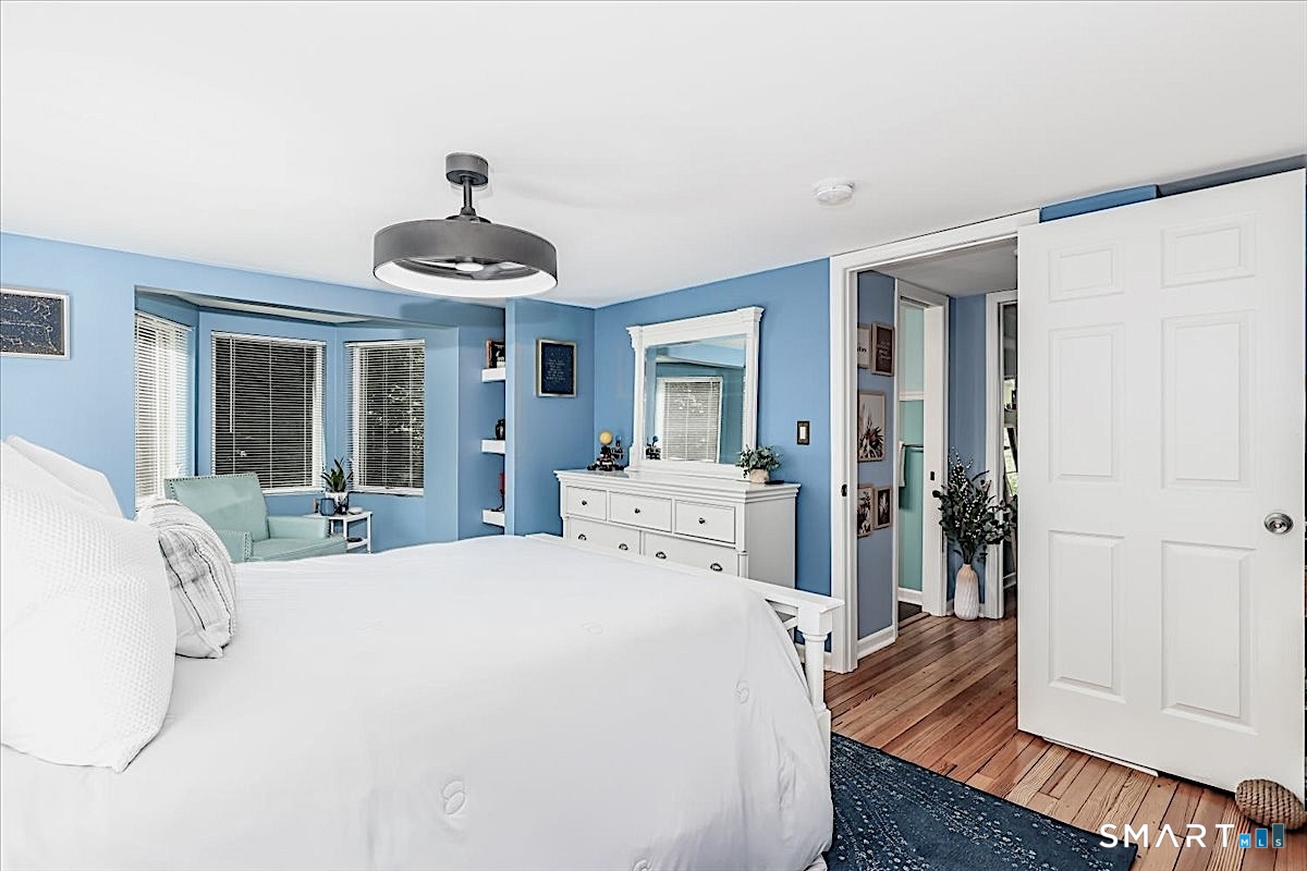 313 Torrington Road Litchfield, CT 06759 - Photo 17 of 26 Built-in Corner Shelving, Nice Closet Space and a Modern Ceiling Fixture Add Character and Functionality