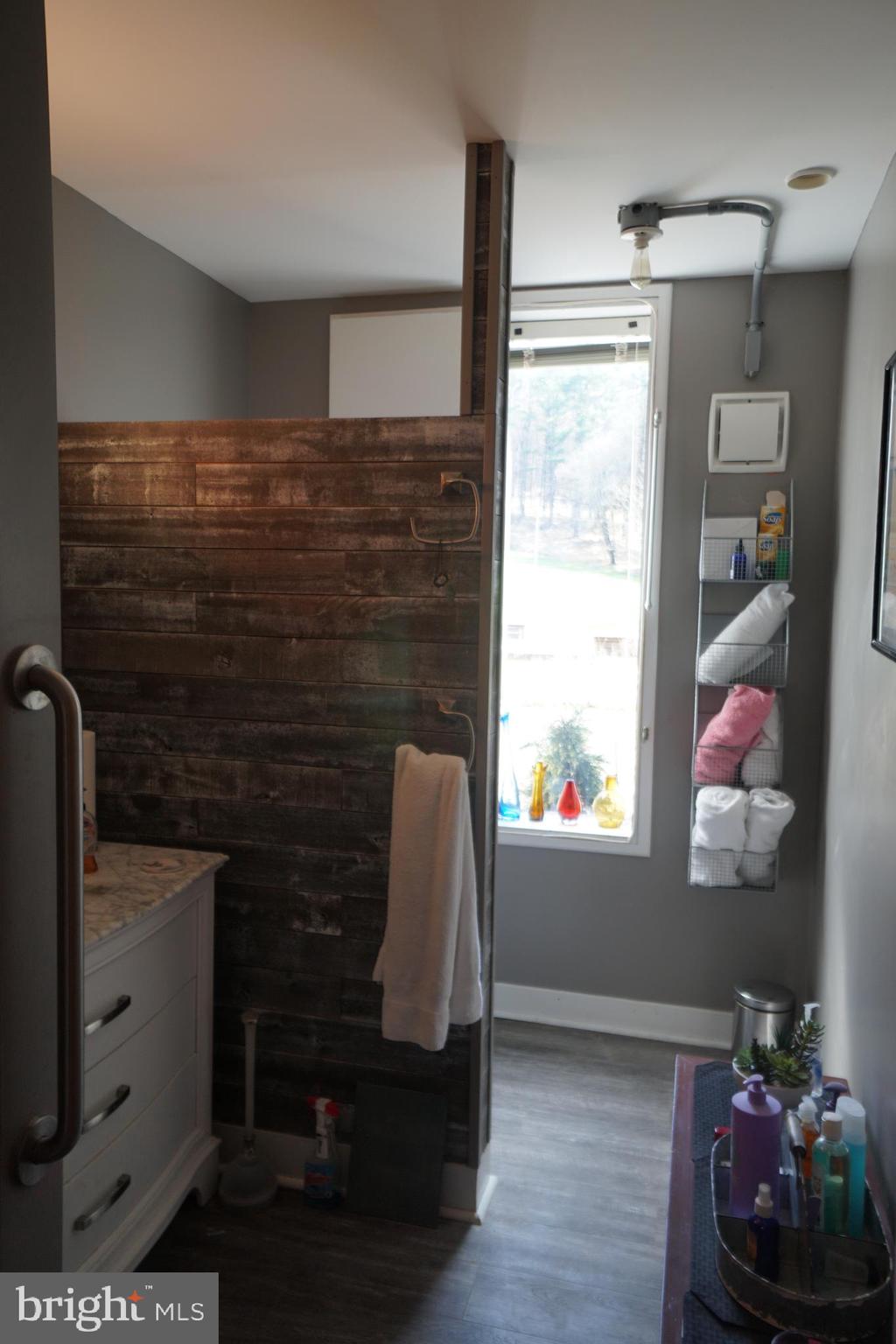 1873 Capito Hill Road Franklin, WV 26807 - Photo 40 of 72 a bathroom with a sink and a mirror