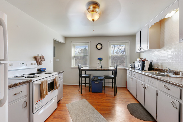 1431 Main Street Crete, IL 60417 - Photo 12 of 17 a kitchen with a stove and a sink