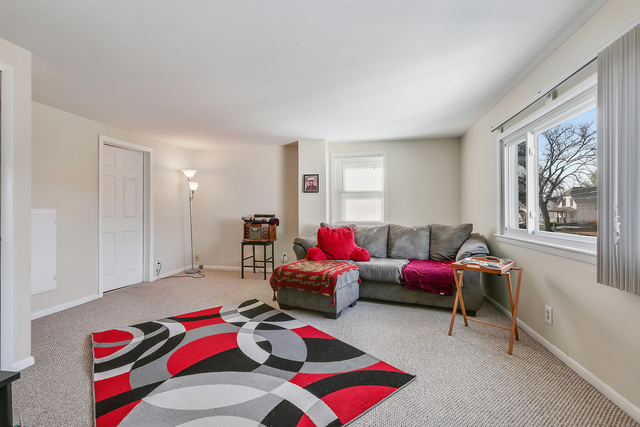 1431 Main Street Crete, IL 60417 - Photo 15 of 17 a living room with furniture and a window