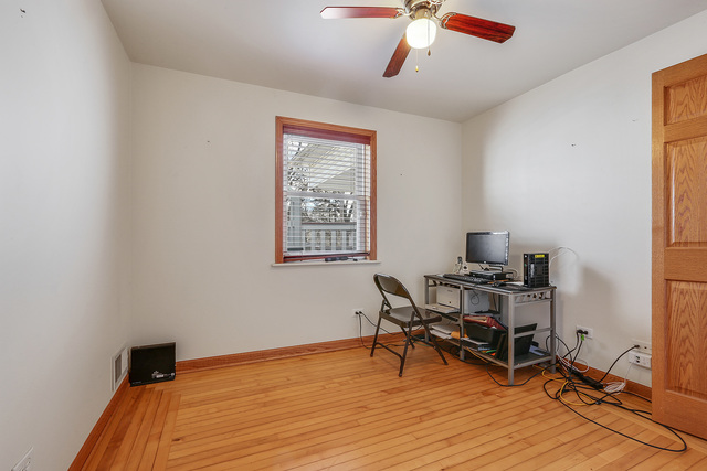 1431 Main Street Crete, IL 60417 - Photo 9 of 17 a view of a workspace with furniture and wooden floor