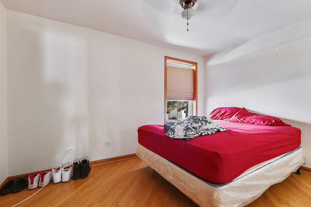 1431 Main Street Crete, IL 60417 - Photo 10 of 17 a bedroom with a bed and window