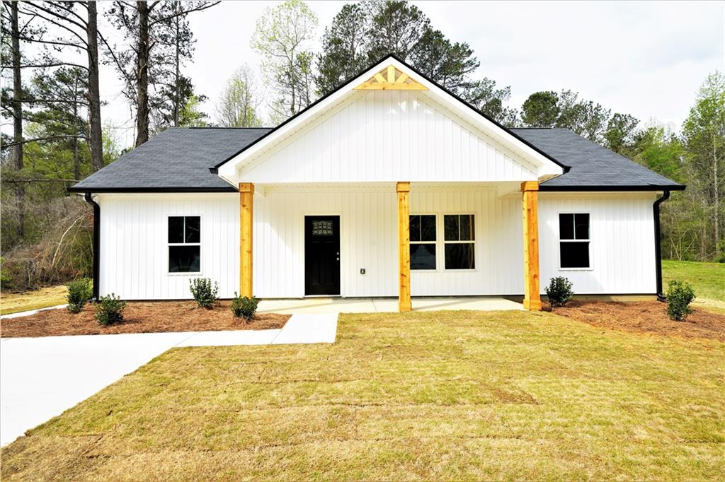 2840 Rockmart Road Villa Rica, GA 30180 - Photo 1 of 1 a view of a house with snow on the side of road