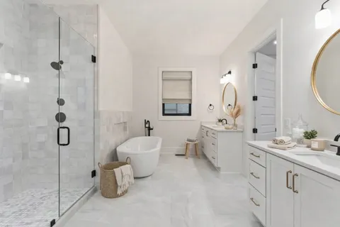 a living room with furniture a flat screen tv and kitchen view