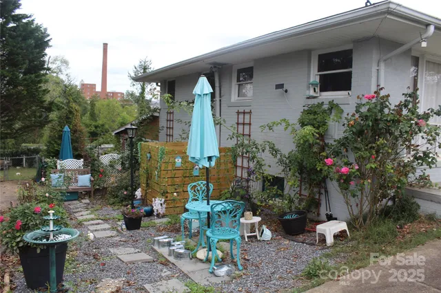 a very nice looking dining room with furniture window and wooden floor