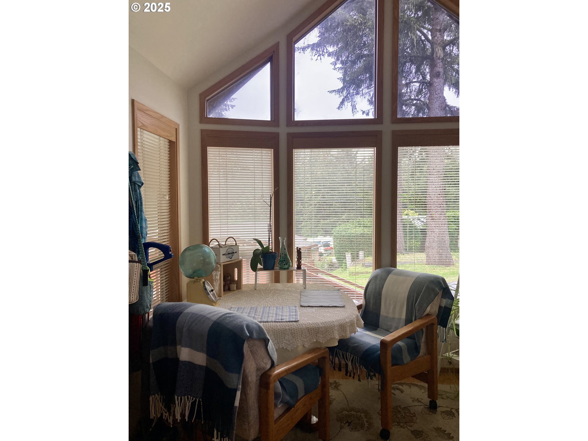 19921 Whaleshead Road, Unit B2 Brookings, OR 97415 - Photo 30 of 41 a dining room with furniture and large windows