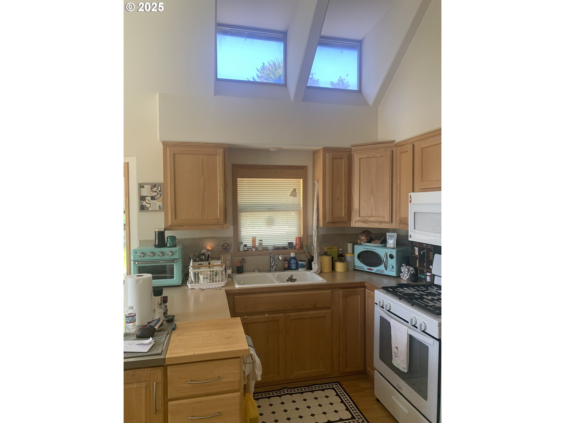 19921 Whaleshead Road, Unit B2 Brookings, OR 97415 - Photo 8 of 41 a kitchen with a sink and cabinets