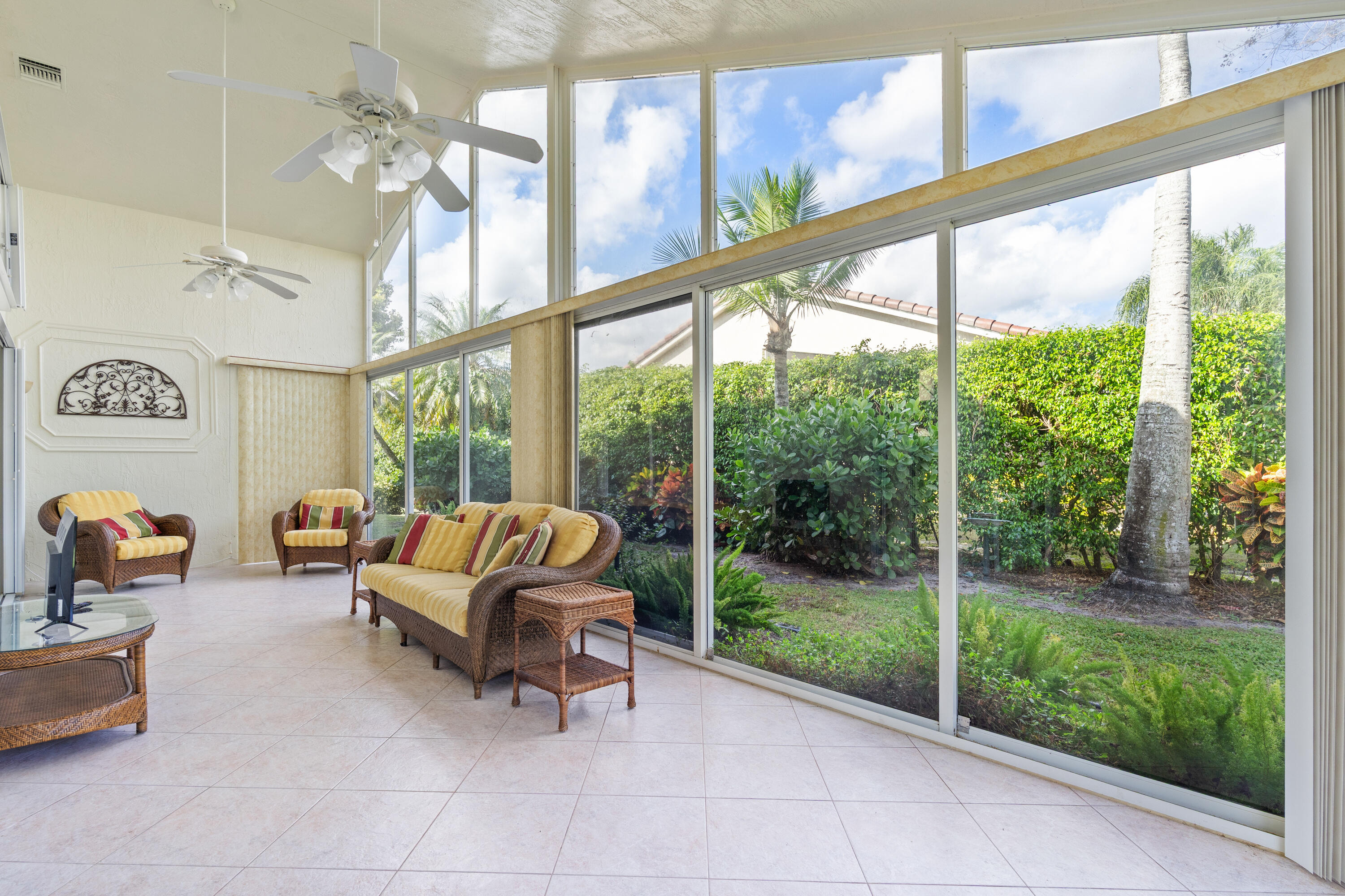 7291 Falls Road East Boynton Beach, FL 33437 - Photo 13 of 26 a living room with furniture and a floor to ceiling window