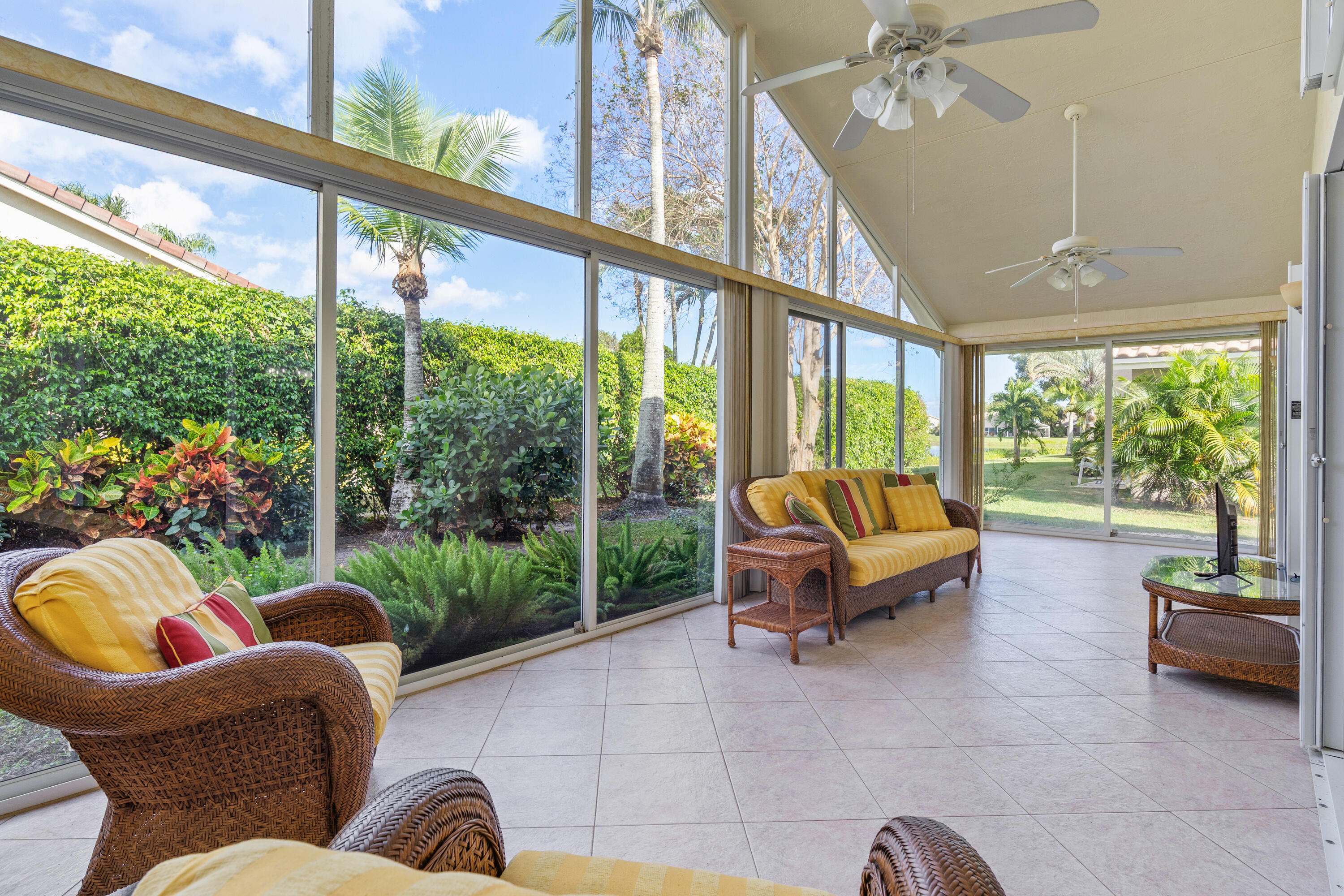 7291 Falls Road East Boynton Beach, FL 33437 - Photo 14 of 26 a living room with patio furniture and a potted plant