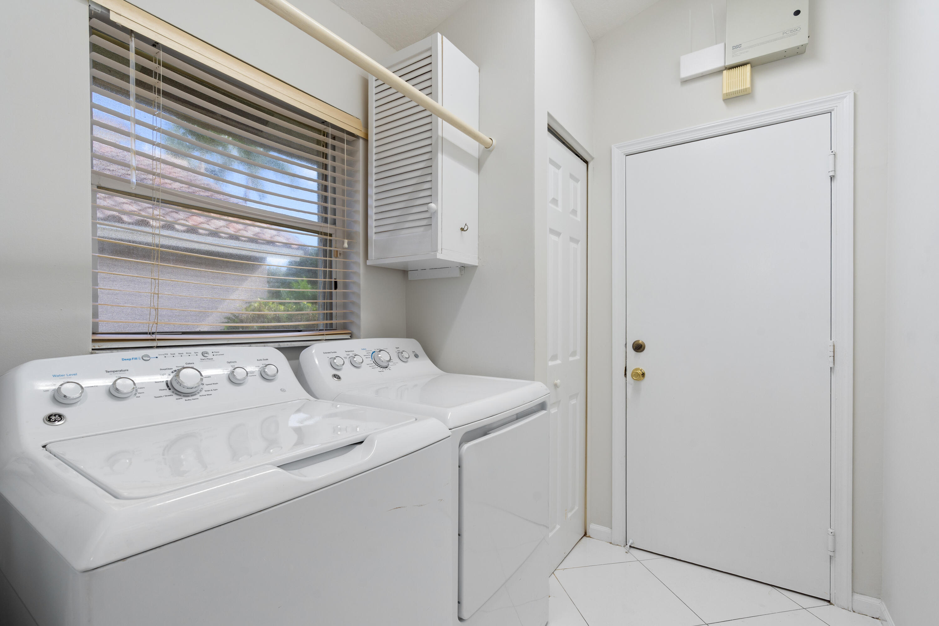 7291 Falls Road East Boynton Beach, FL 33437 - Photo 15 of 26 a utility room with dryer and washer