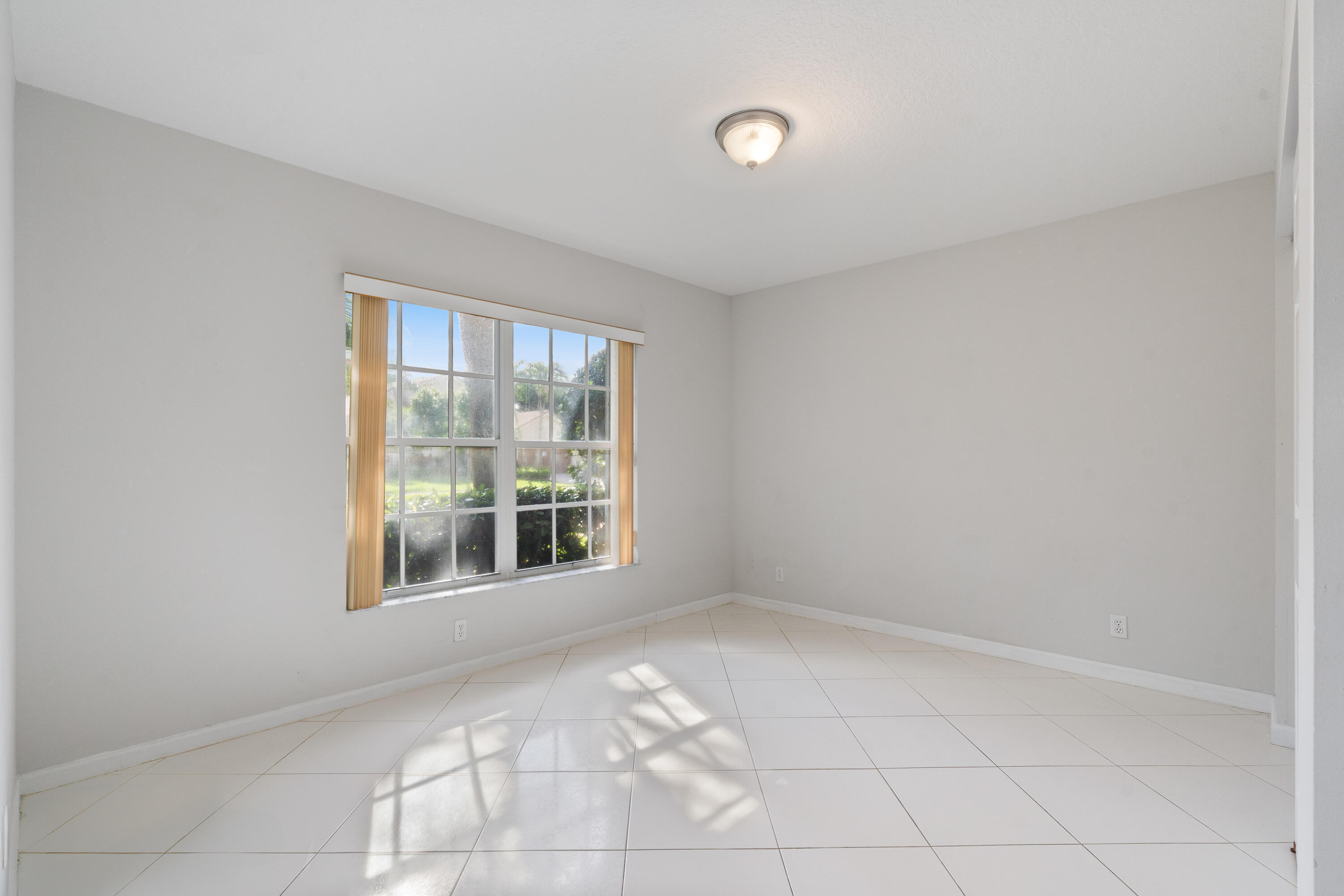 7291 Falls Road East Boynton Beach, FL 33437 - Photo 16 of 26 an empty room with windows