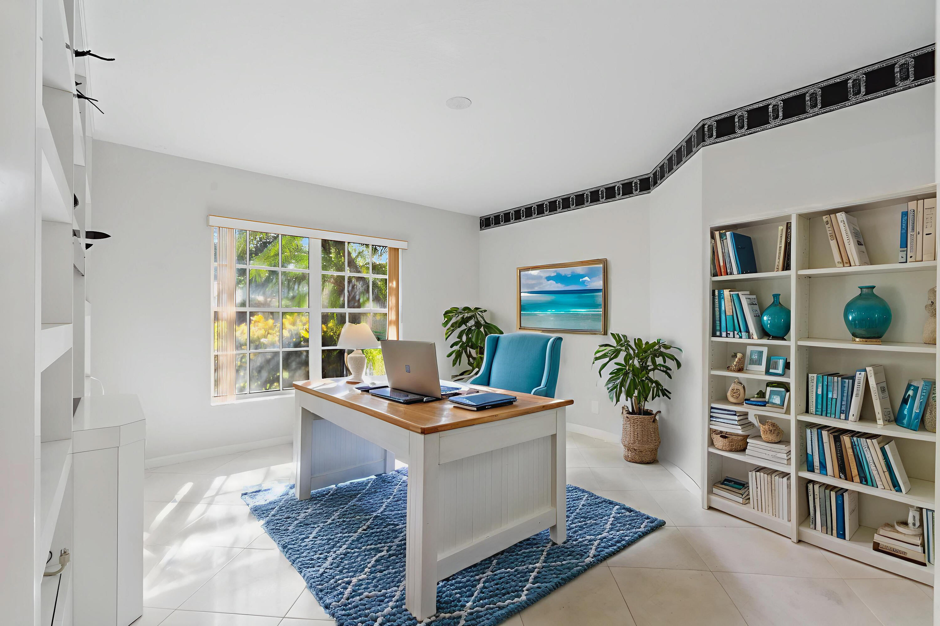 7291 Falls Road East Boynton Beach, FL 33437 - Photo 19 of 26 a room with furniture and a book shelf