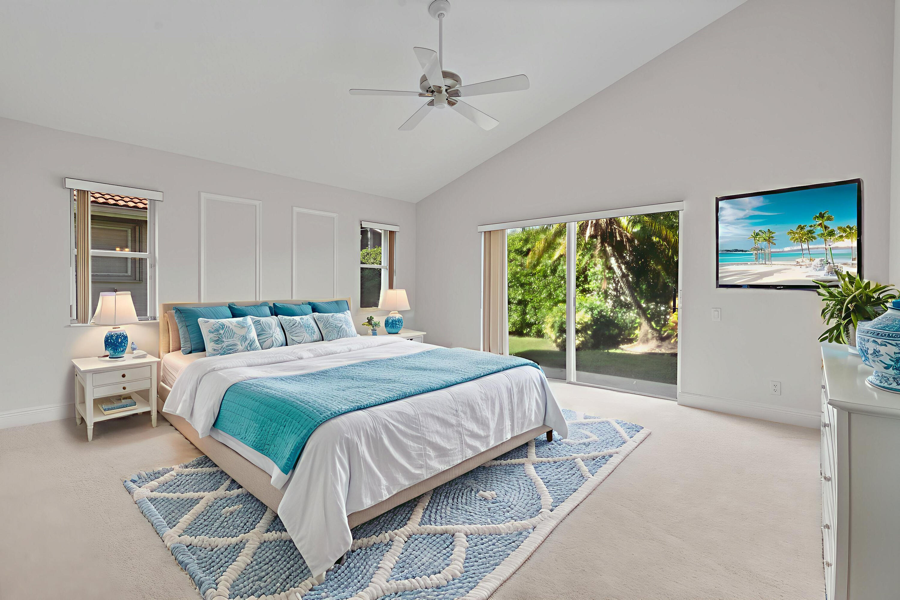 7291 Falls Road East Boynton Beach, FL 33437 - Photo 26 of 26 a bedroom with a large bed and a window