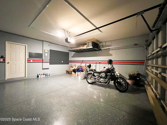 a view of a garage with a bike and a car