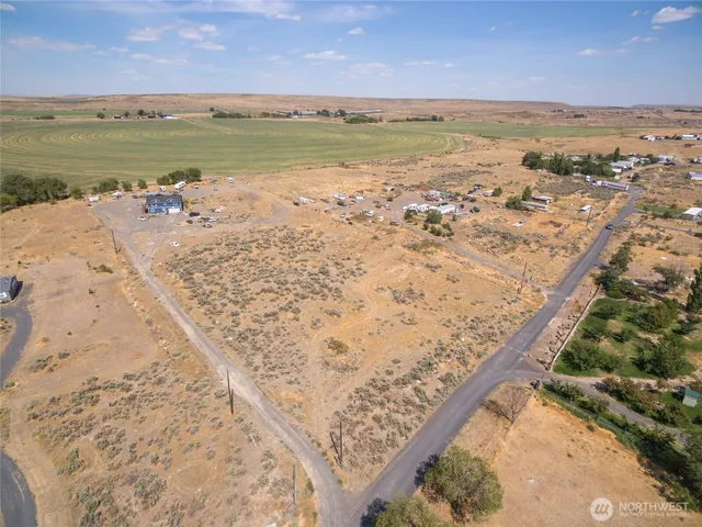 an aerial view of beach and covered with trees