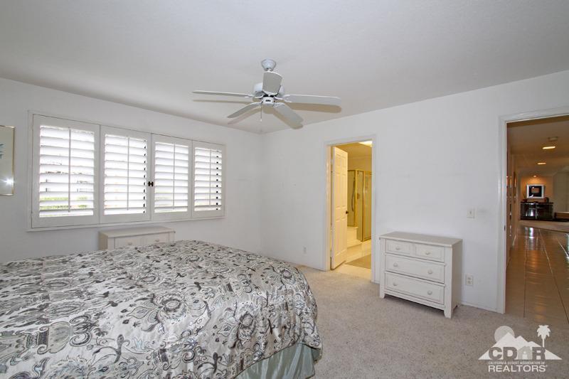52 Maximo Way Palm Desert, CA 92260 - Photo 11 of 20 a bedroom with a bed and a window