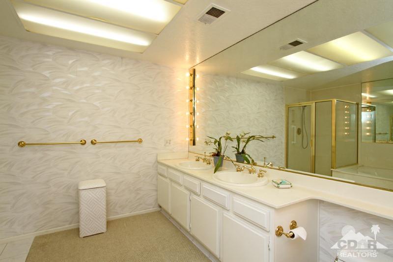 52 Maximo Way Palm Desert, CA 92260 - Photo 12 of 20 a bathroom with a double vanity sink a mirror and a shower