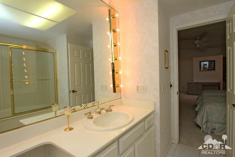 52 Maximo Way Palm Desert, CA 92260 - Photo 14 of 20 a bathroom with a sink and a mirror